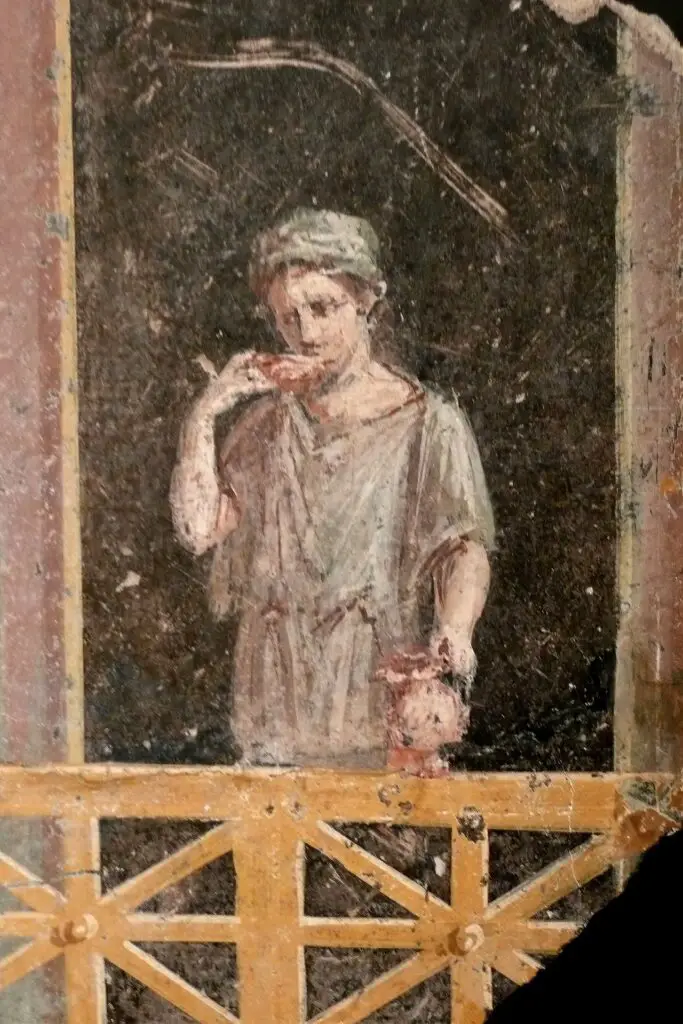 Fresco de una joven mujer romana vestida para las tareas del día a día.
